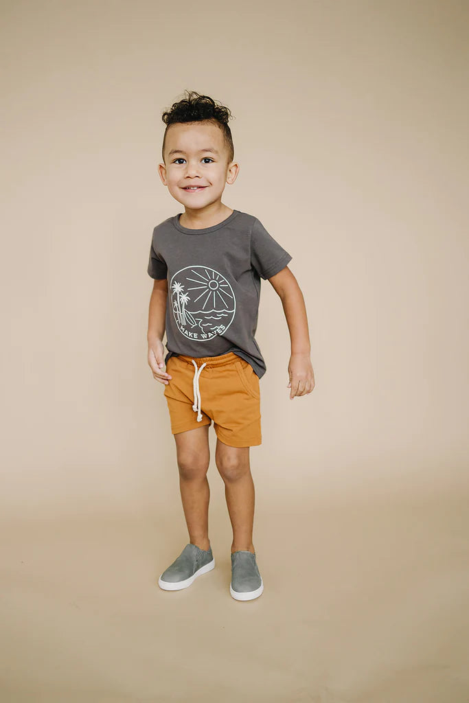 model wearing mustard shorts