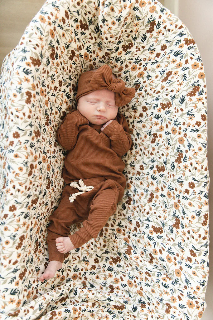 baby wearing ribbed rust outfit