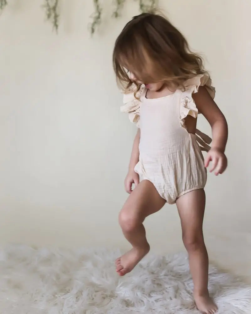 standing model wearing ruffle top outfit